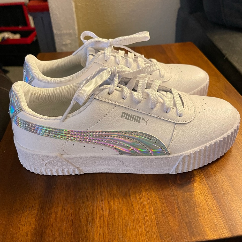 Size 8.5 white and silver Puma Carina Sneakers. New w/o box.